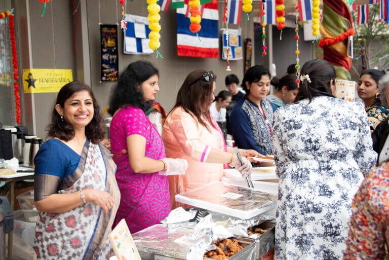 Members of our YIS community running the Indian food booth at the Food Fair.